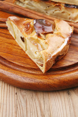 sweet food : cuts of apple pie on wooden plate