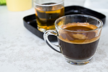 Black coffee and tea on white table