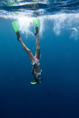 Young woman diving