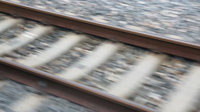 Close view of railroad track moving at high speed