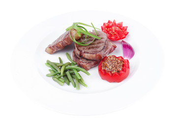 beef steaks strips on white plate