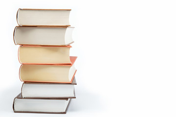 A stack of books on a white background.