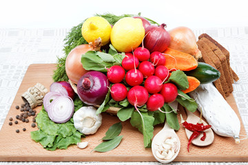 Healthy food. Fresh vegetables and fruits on a wooden board.