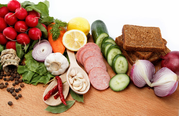 Healthy food. Fresh vegetables and fruits on a wooden board.
