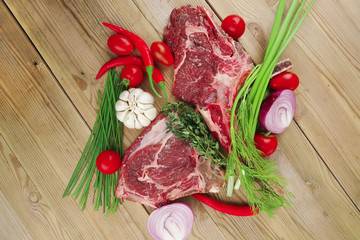 fresh lamb ribs served with thyme , red chili pepper