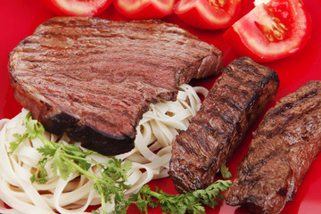 italian cuisine : grilled steak with pasta