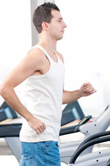 Man at the gym exercising. Run.