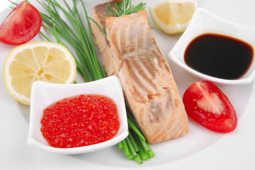 roasted salmon strips with red caviar and tomatoes
