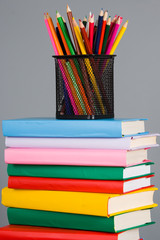 Pencils on the stack of books