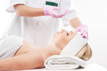 Obraz premium Portrait of a young woman on a botox injection procedure