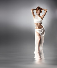 Fashion shoot of a young woman in a long white dress - obrazy, fototapety, plakaty