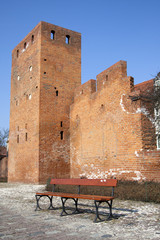 Wall of Warsaw castle and empty bench