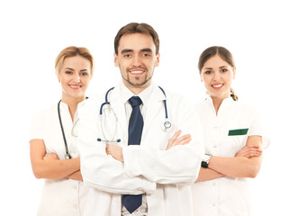 A team of three young Caucasian doctors in white clothes