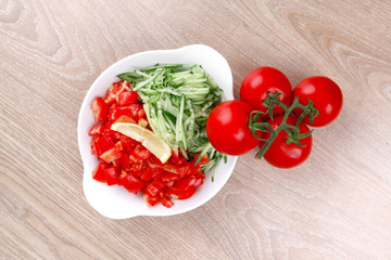 whole tomatoes on branch with salad