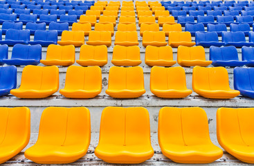 Empty plastic seats in a stadium