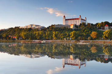 Obraz premium Bratislava castle with reflection in river Danube - Slovakia