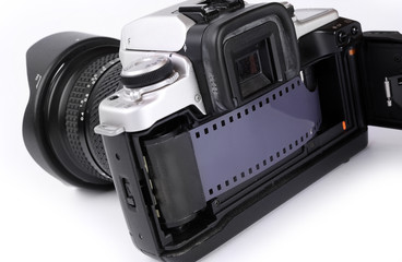 Vintage camera with old 35 mm film strip.