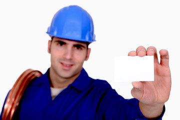 Plumber holding business card