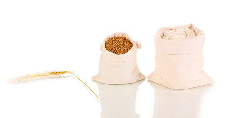 Fototapeta na wymiar Flour and wheat grain isolated on white