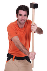 Worker holding hammer