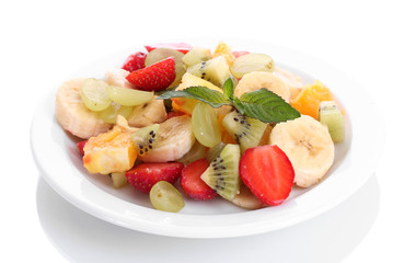 Fresh fruits salad on plate isolated on white