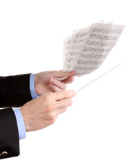 Fototapeta premium Music conductor hands with baton and notes isolated on white