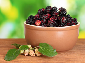 Ceramical bowl with ripe mulberries