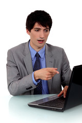 Businessman demonstrating a laptop
