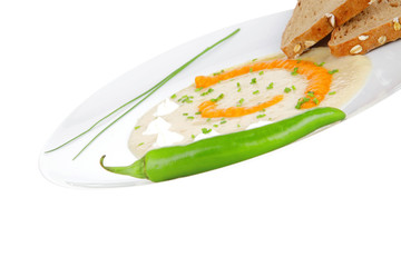 isolated salmon soup with bread and pepper