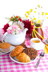 breakfest with tea, cake and yellow flowers