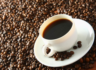 Espresso cup with coffee beans