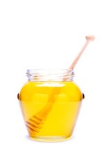 glass of honey isolated on white