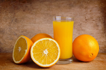 fresh orange juice and oranges