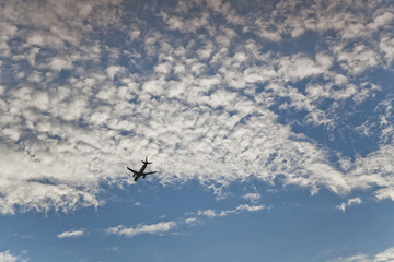 Fototapeta na wymiar Clouds, blue sky and airplane