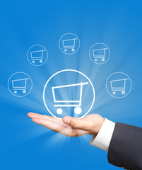 shopping cart icon on business hand