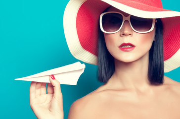 summer girl holding an airplane