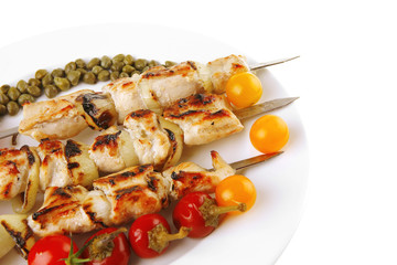 roast pork shish kebab on white