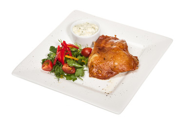 roasted chicken with vegetables on a white plate