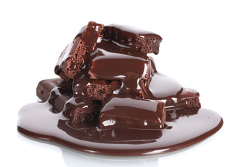 Slices of milk and dark chocolate bar poured chocolate isolated