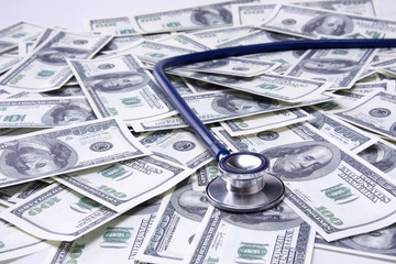 heap of dollars with stethoscope