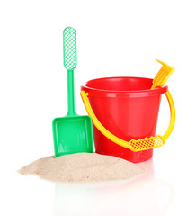 Children's beach toys and sand isolated on white