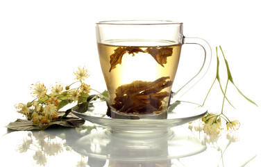 cup of linden tea and flowers isolated on white