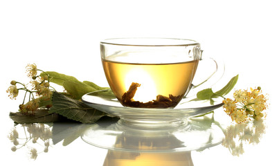 cup of linden tea and flowers isolated on white