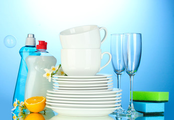empty clean plates, glasses and cups with dishwashing liquid