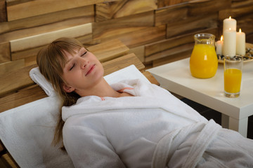 Relax spa woman lying on wooden chair