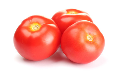 Ripe red tomatoes isolated on white