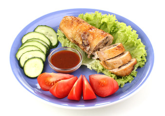 Tasty meat cutlet with garnish on plate isolated on white