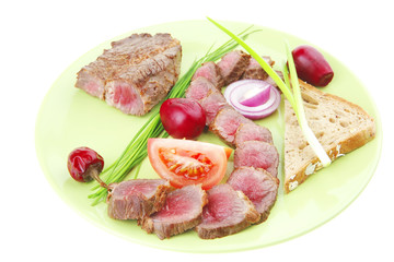 meat food : roast red meat slices served on green plate