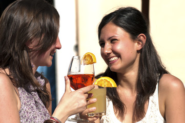 Two young While They Take a Cold Cocktail