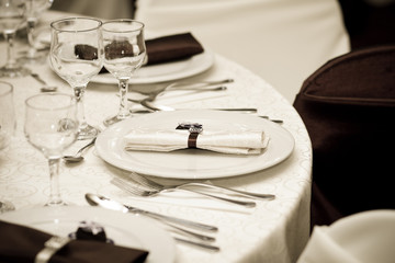 elegant decoration of table in a restaurant in sepia tones
